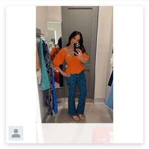 Orange off the shoulder flowy top